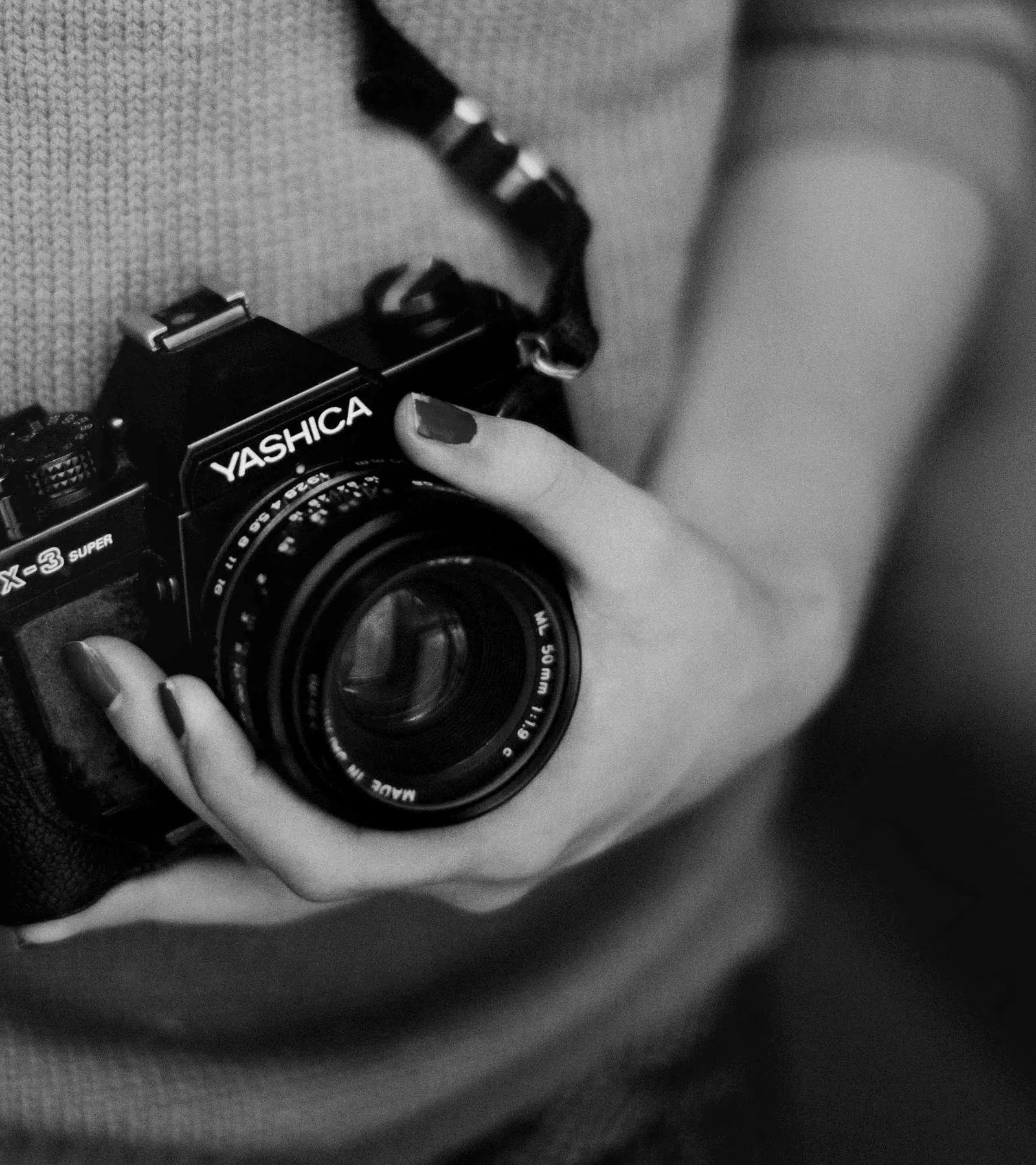 Hands holding a camera