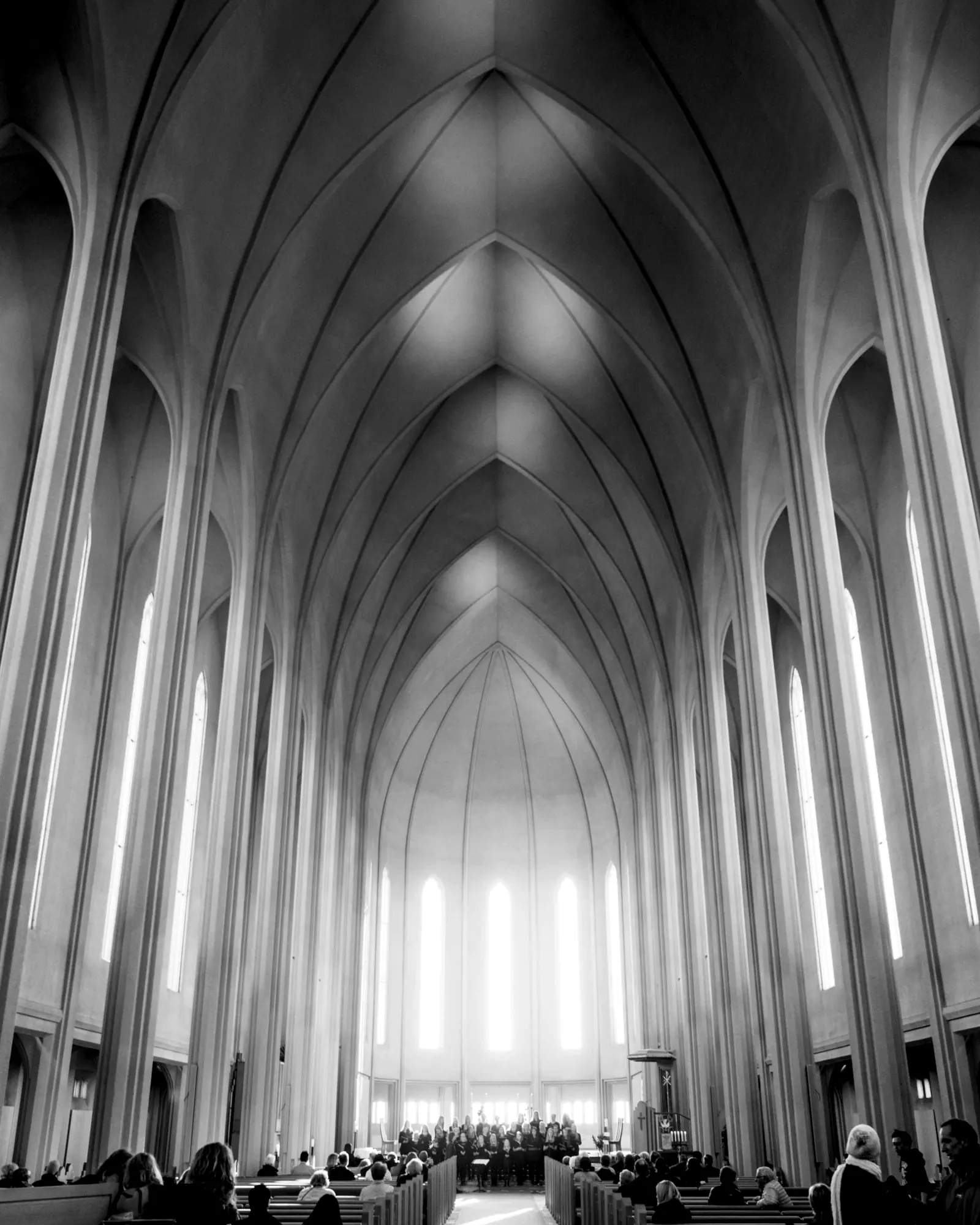 Tall pointed arches inside a pale interior