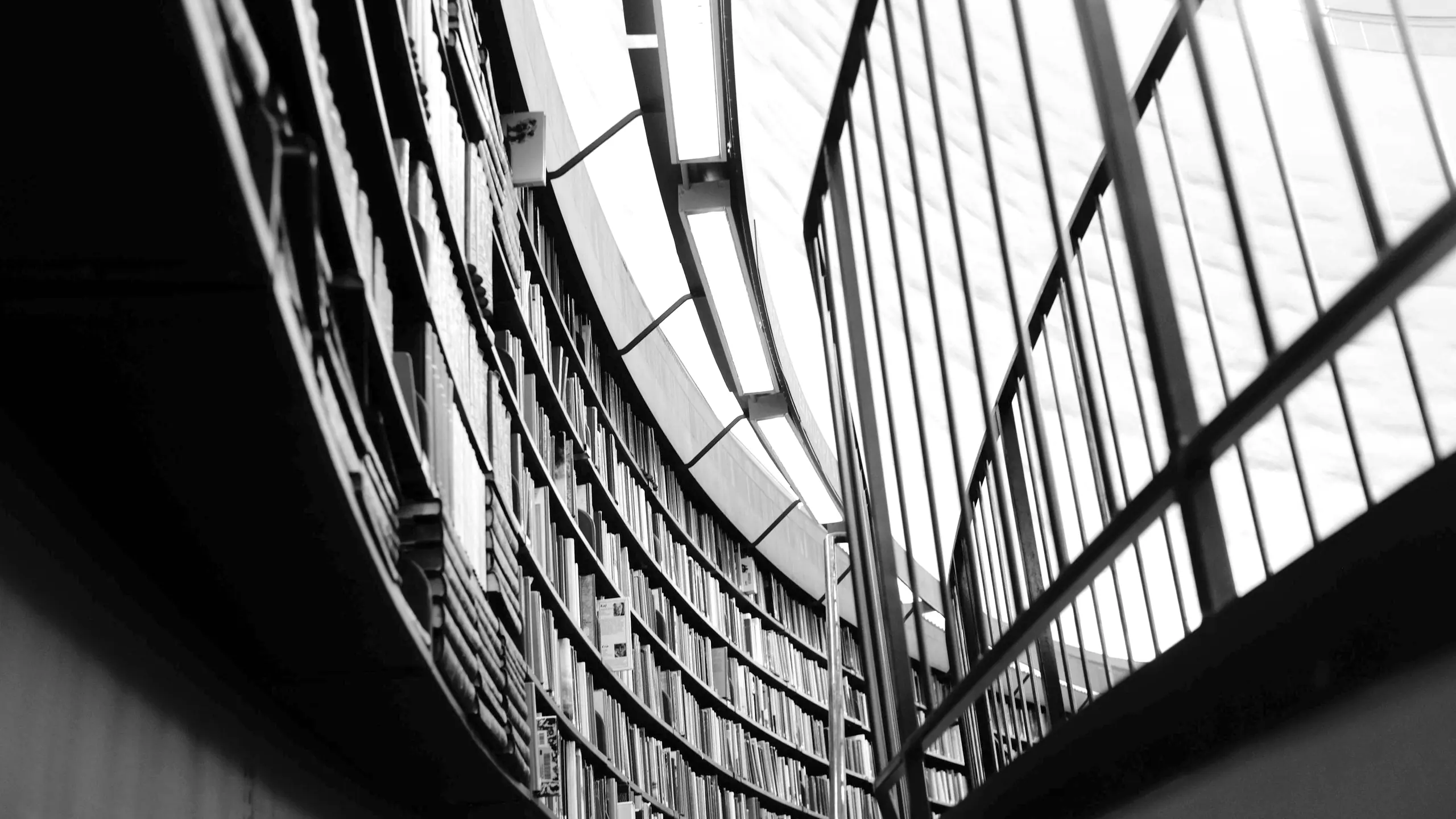 A curved glass facade seen from below