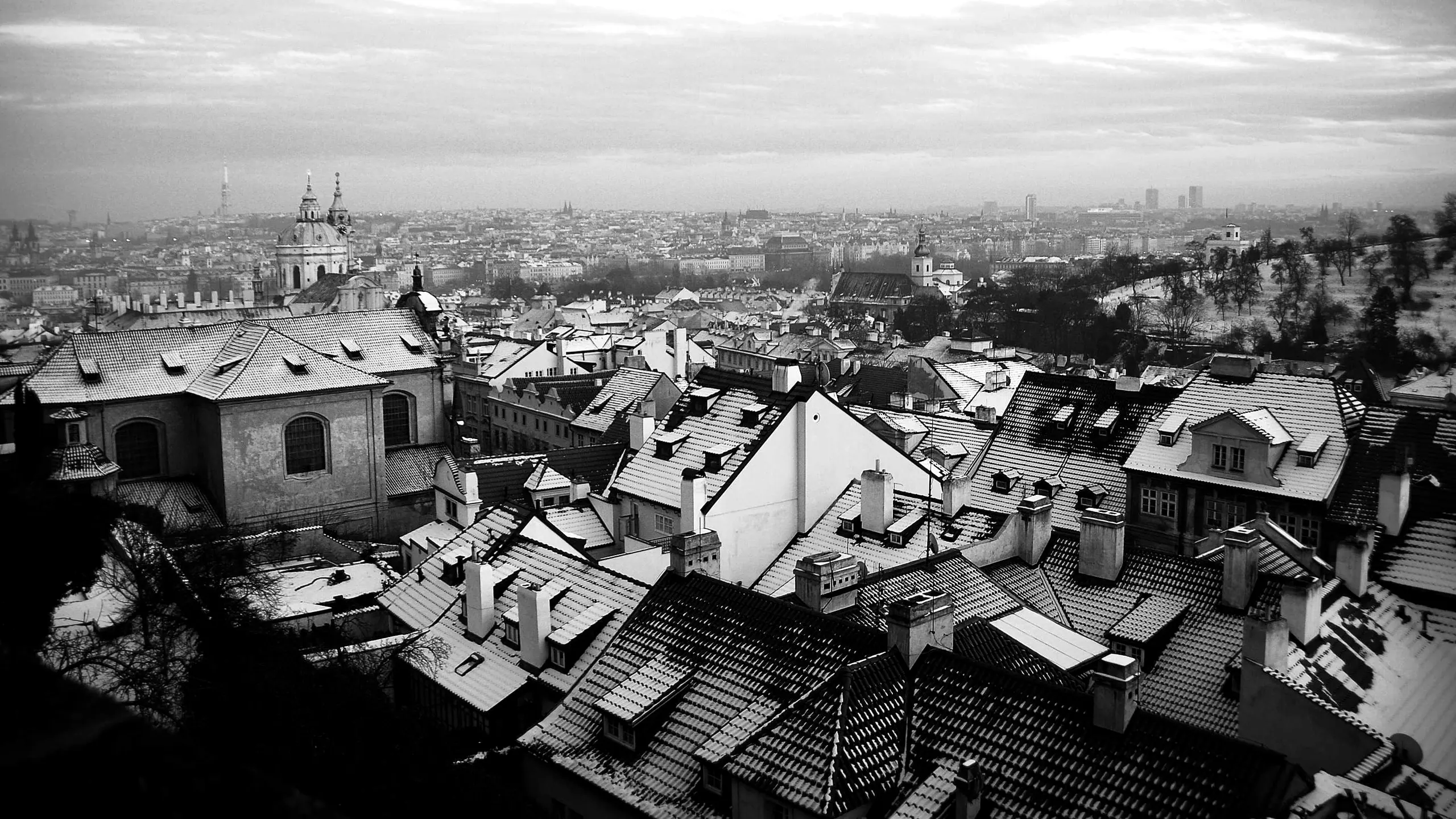 Rooftops of an old city under cloud