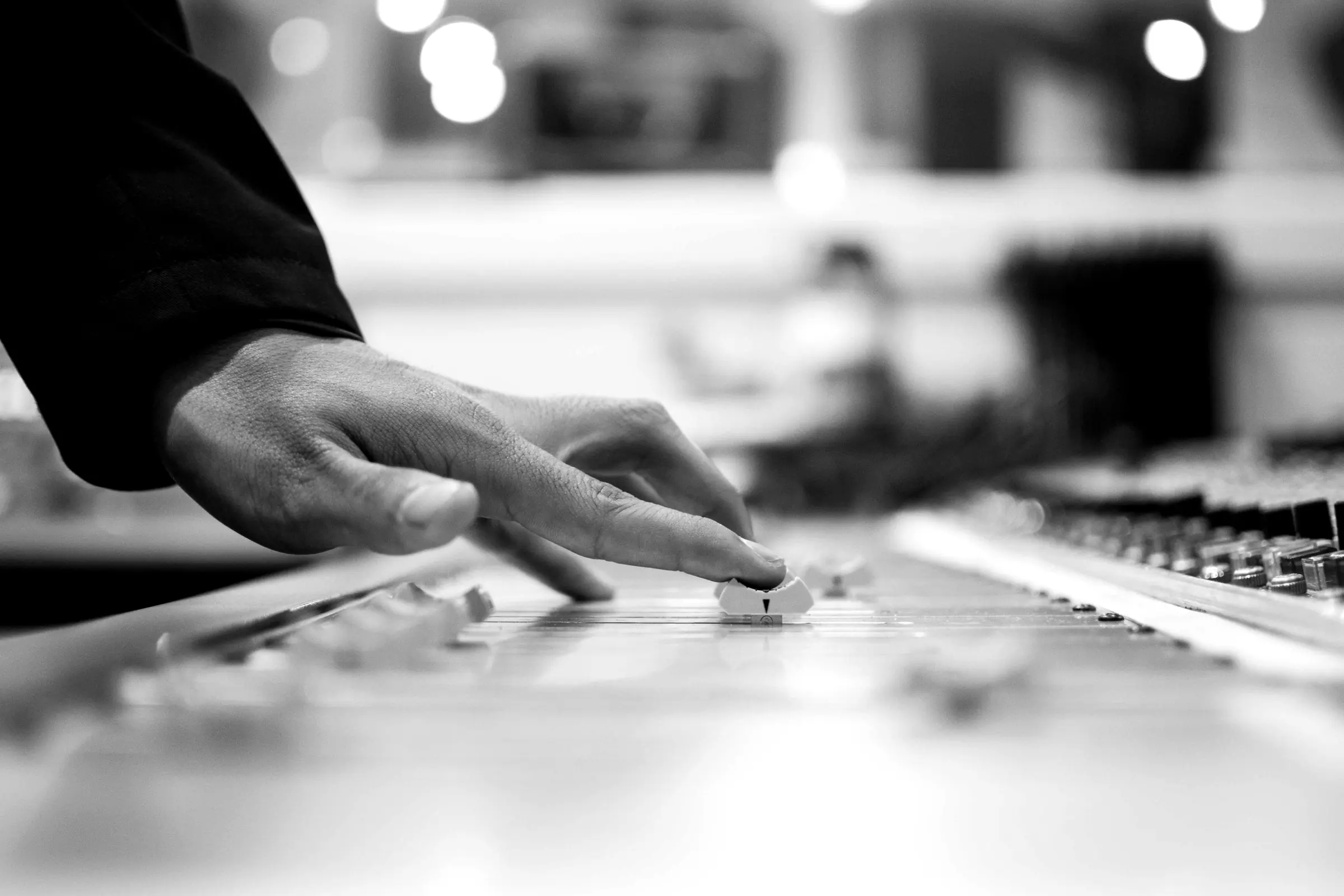 A hand moving over keys in soft focus