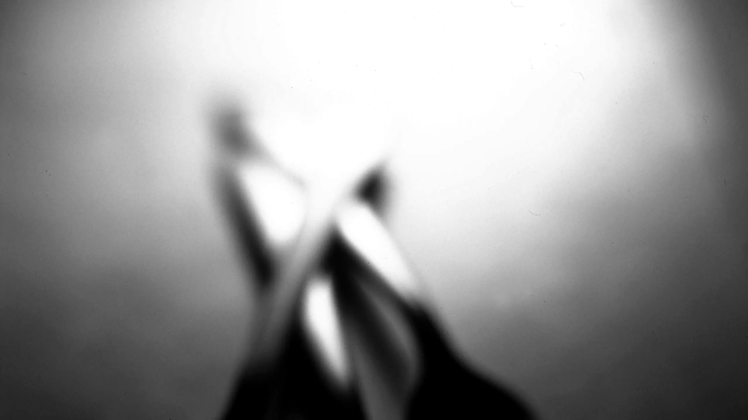 Three forks crossed in dark light
