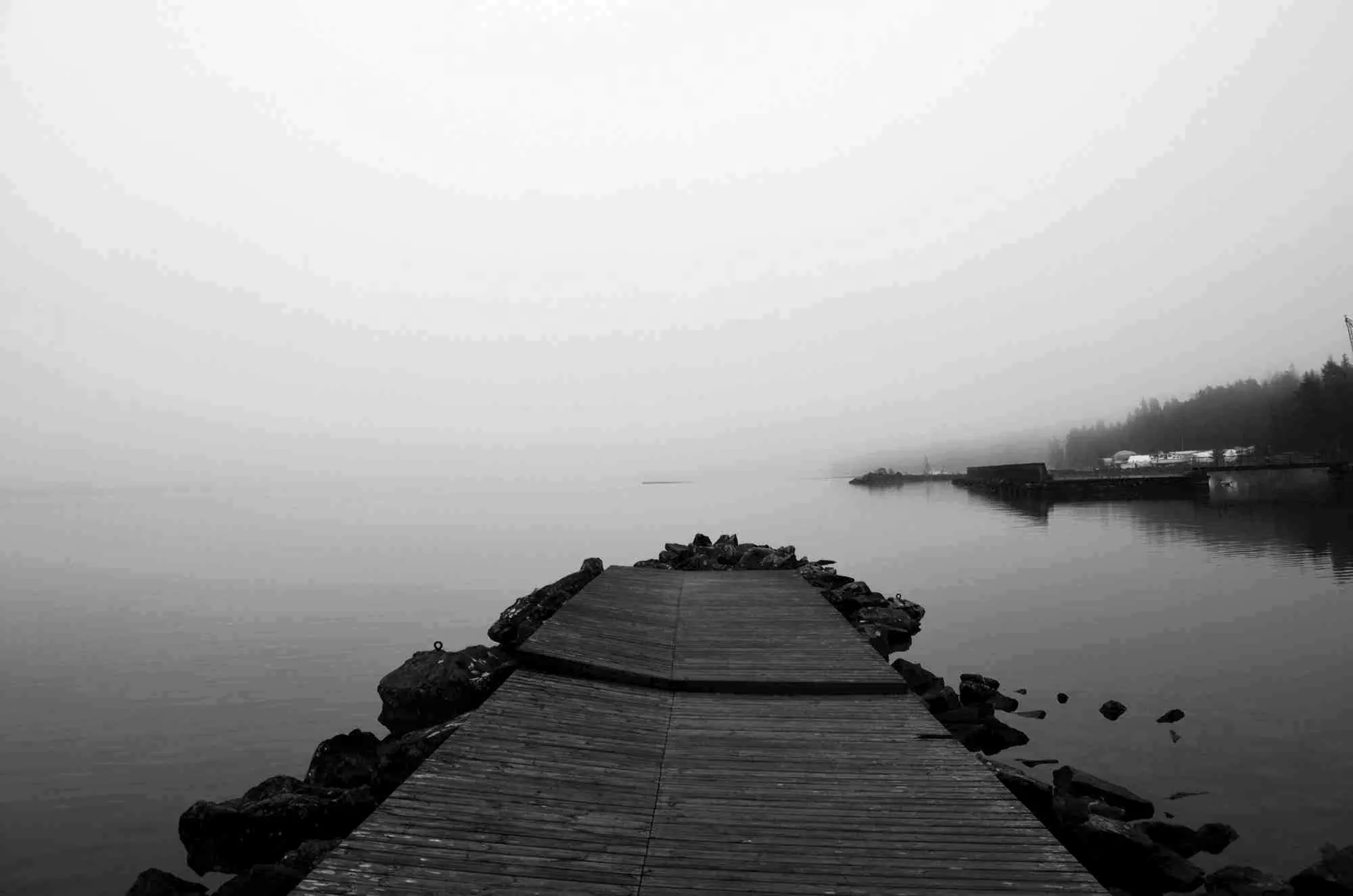 A jetty fading into fog