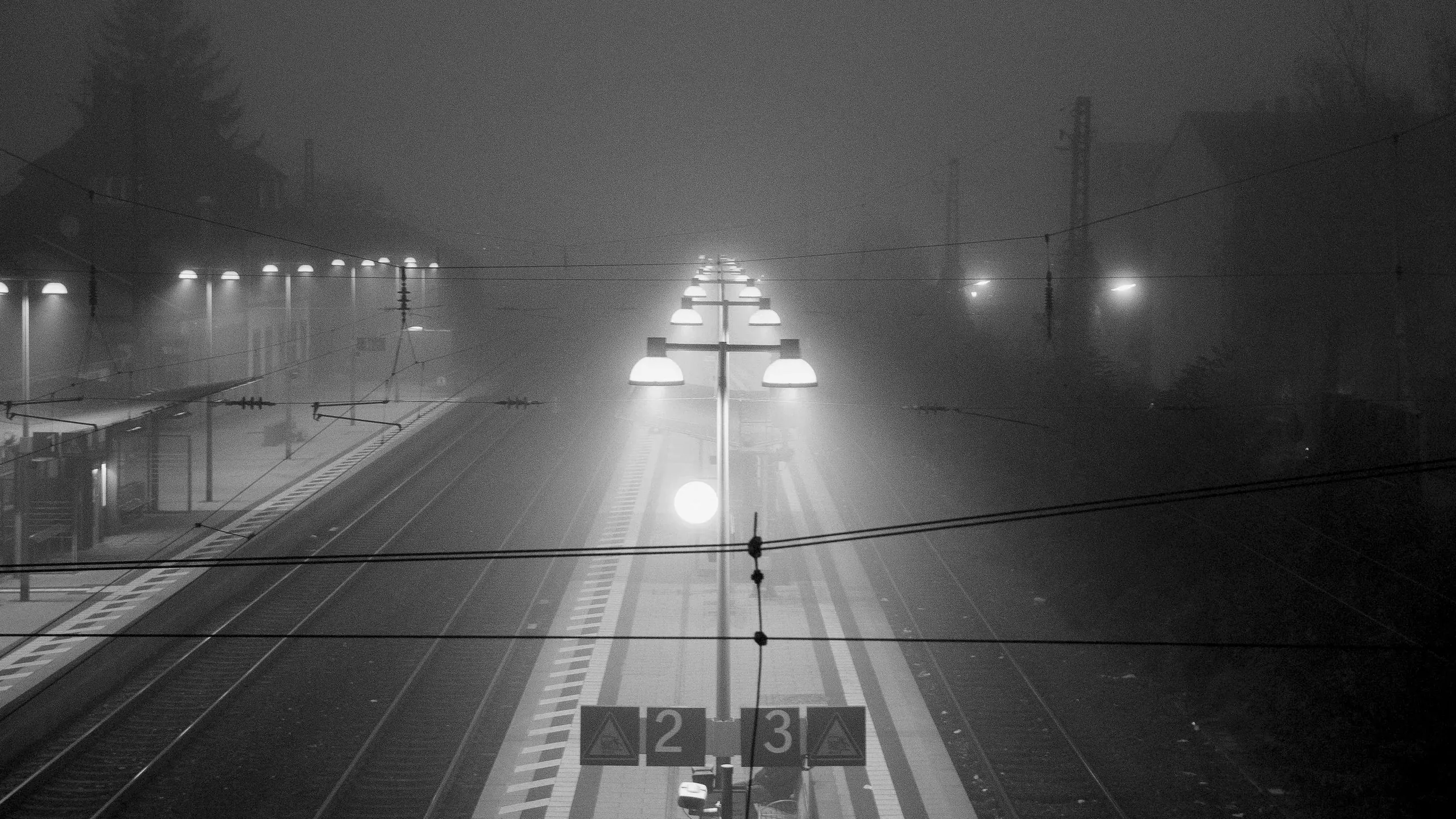 Station lights glowing in fog