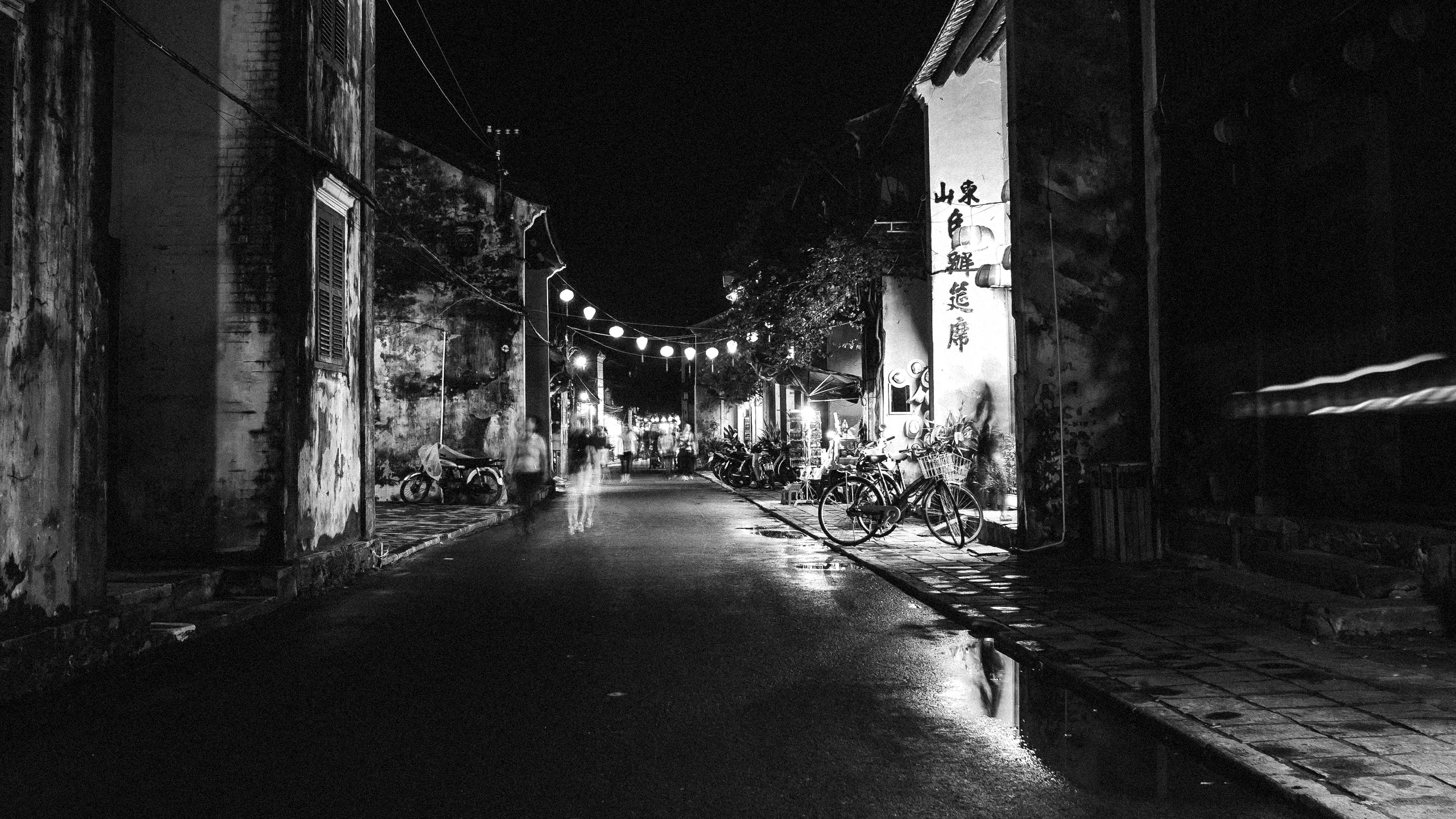 A lantern-lit alley at night
