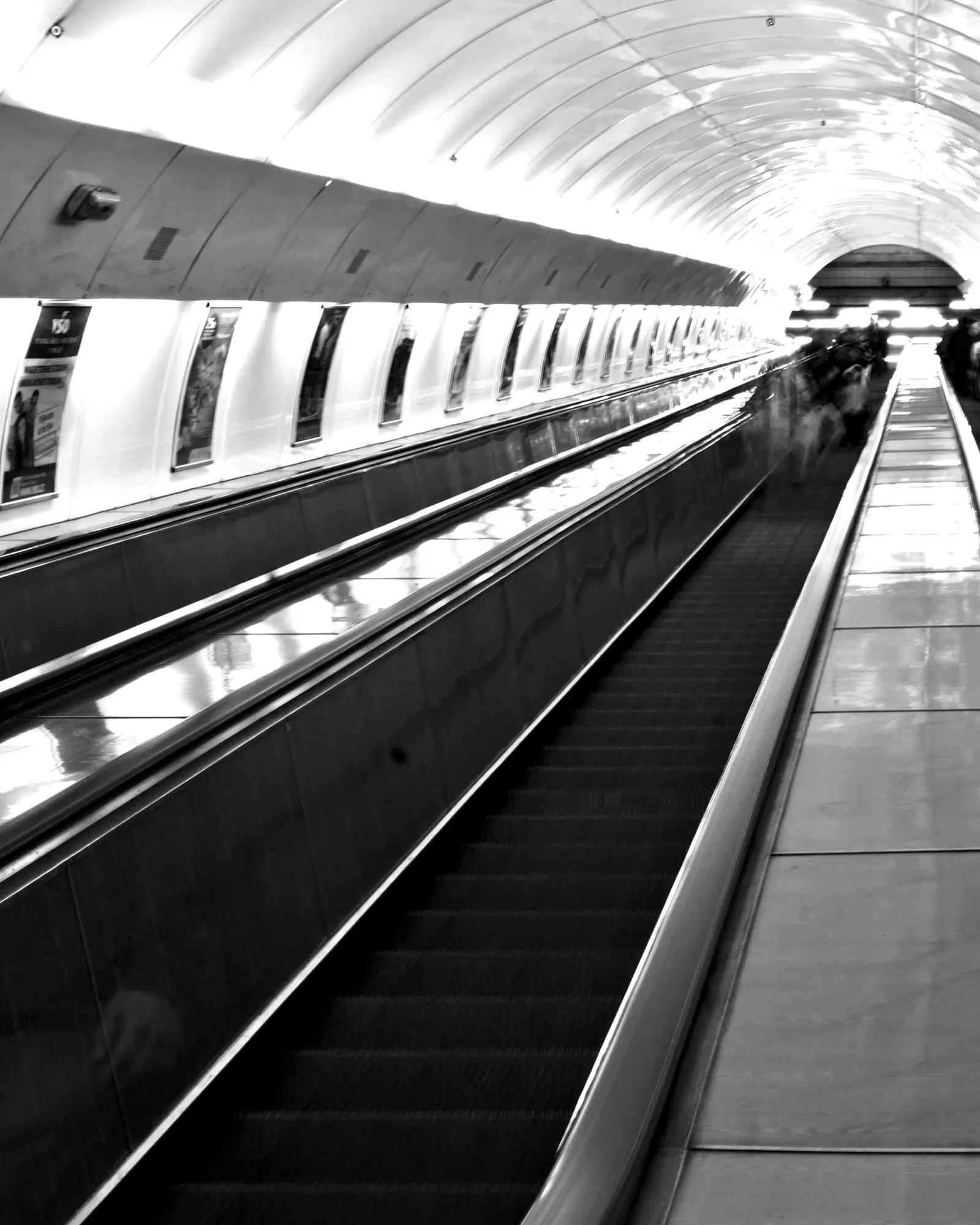 A long moving walkway in a tunnel