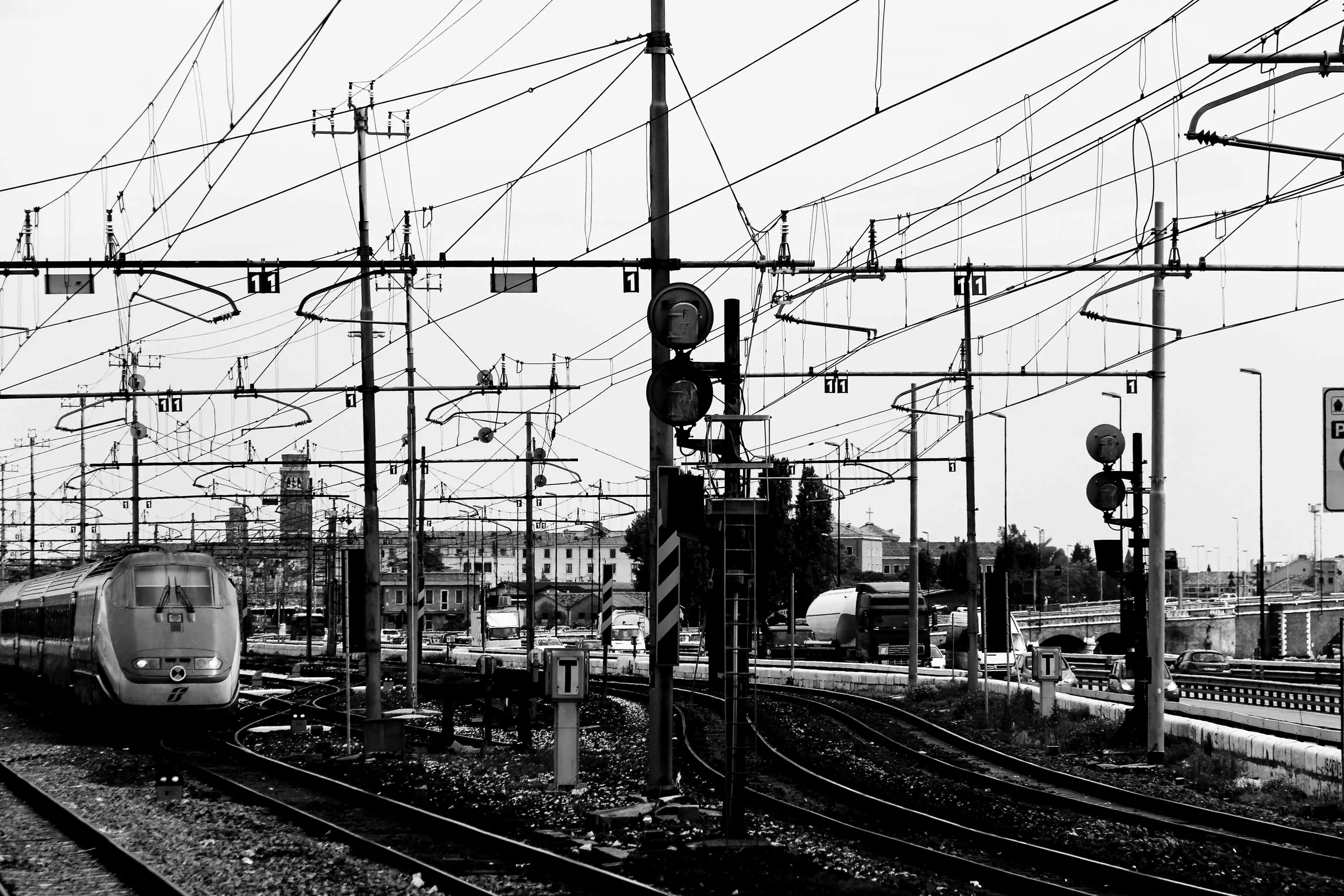 Overhead lines and signals above a railway yard